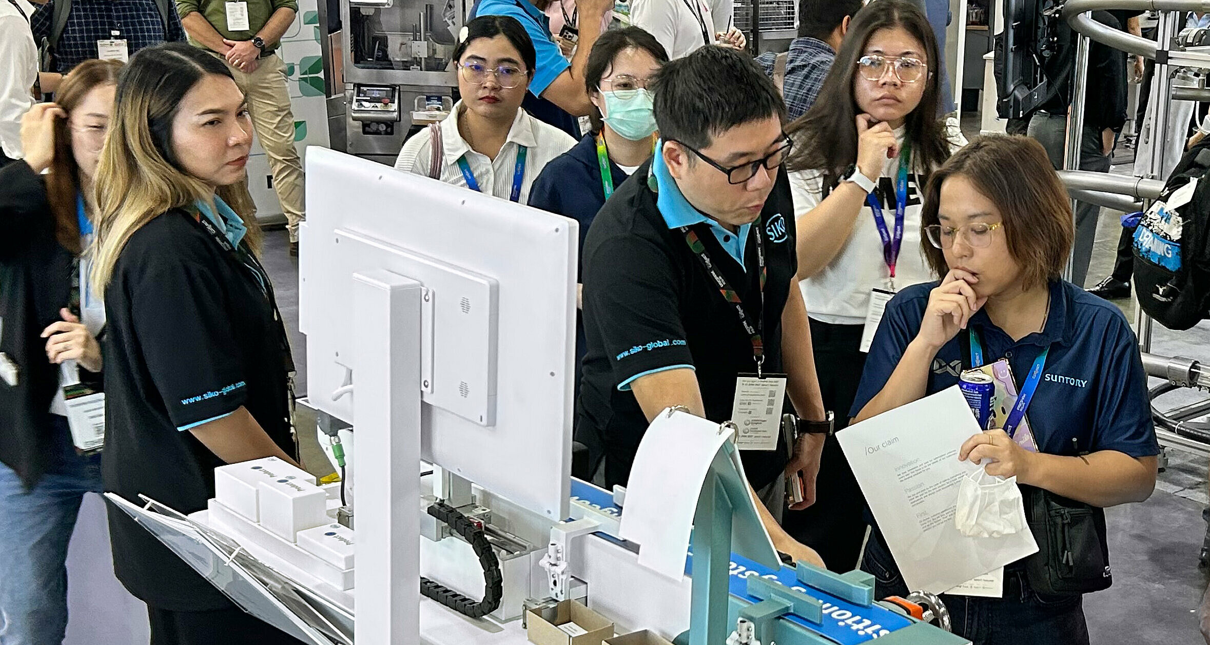 Advising Asian prospects at a trade Show